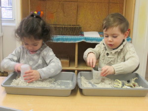 We also enjoyed discovering the properties of the 'moon sand'--filling up cups, packing it down, even scooping it out of the tray and dumping it on the floor (a few times!).